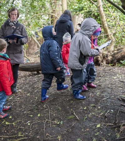 child and parents on a wild wood hunt